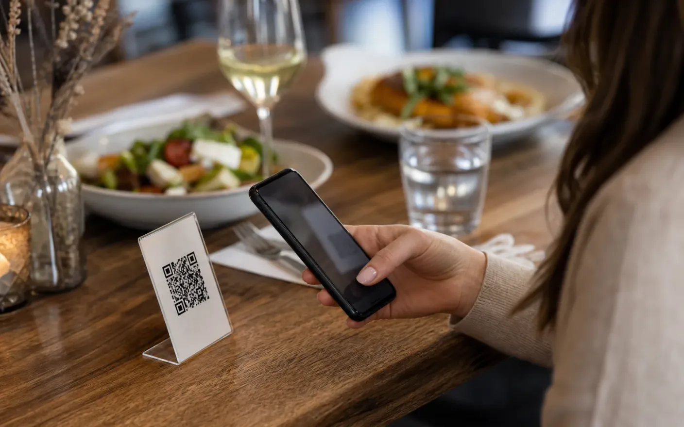 Catering Services guest scanning a QR menu at a table